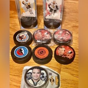 Lot Of 9 Collectible Hockey Pucks​​​​​​​​​​​